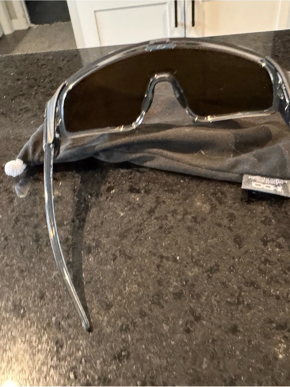 Oakley Shield Sunglasses with Red-Orange Mirrored Lens and Clear Frame